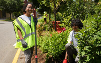 Volunteers from WooServes pose for a photo as they work to help plant.
