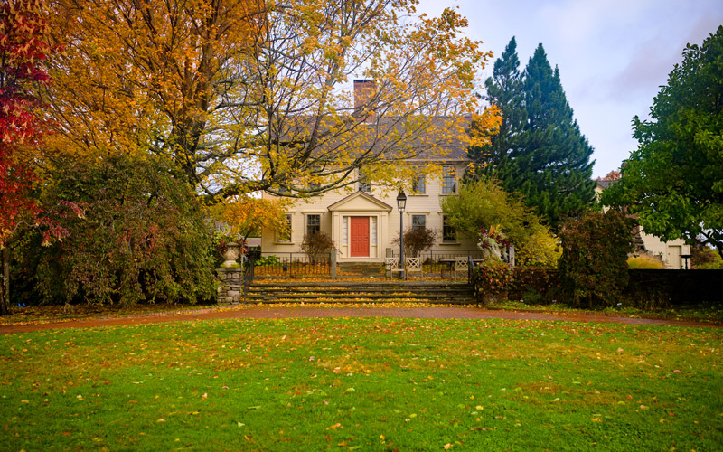 Farmhouse and fall foliage at New England Botanic Garden