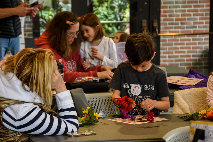 Children making a craft during vacation week.