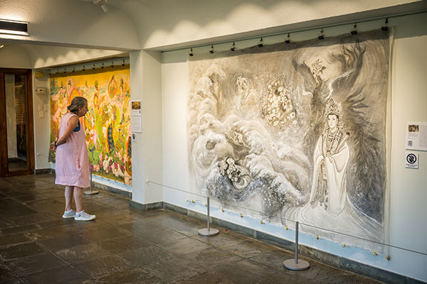 A visitor observing the Chinese Empresses exhibit